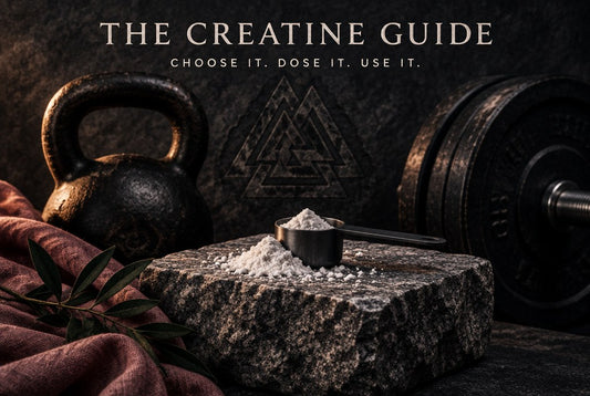The Creatine Guide: white creatine powder and a scoop on a granite plinth with a kettlebell and barbell plates in a dark Norse-style setting